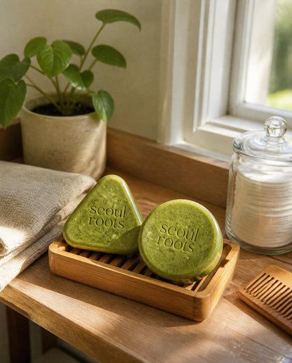 Seoul Roots Scalp Bar and Conditioner Bar on a bamboo dock